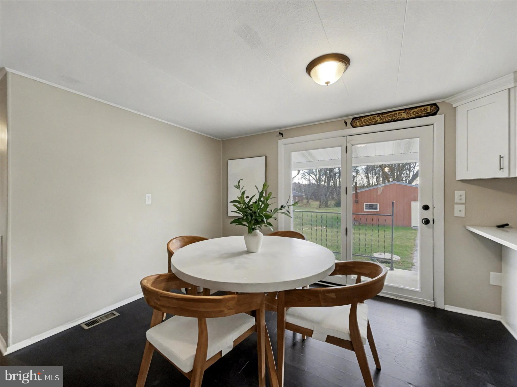 4968 Fairfield Road Fairfield, PA 17320 - Photo 11 of 32 a view of a dining room with furniture and wooden floor