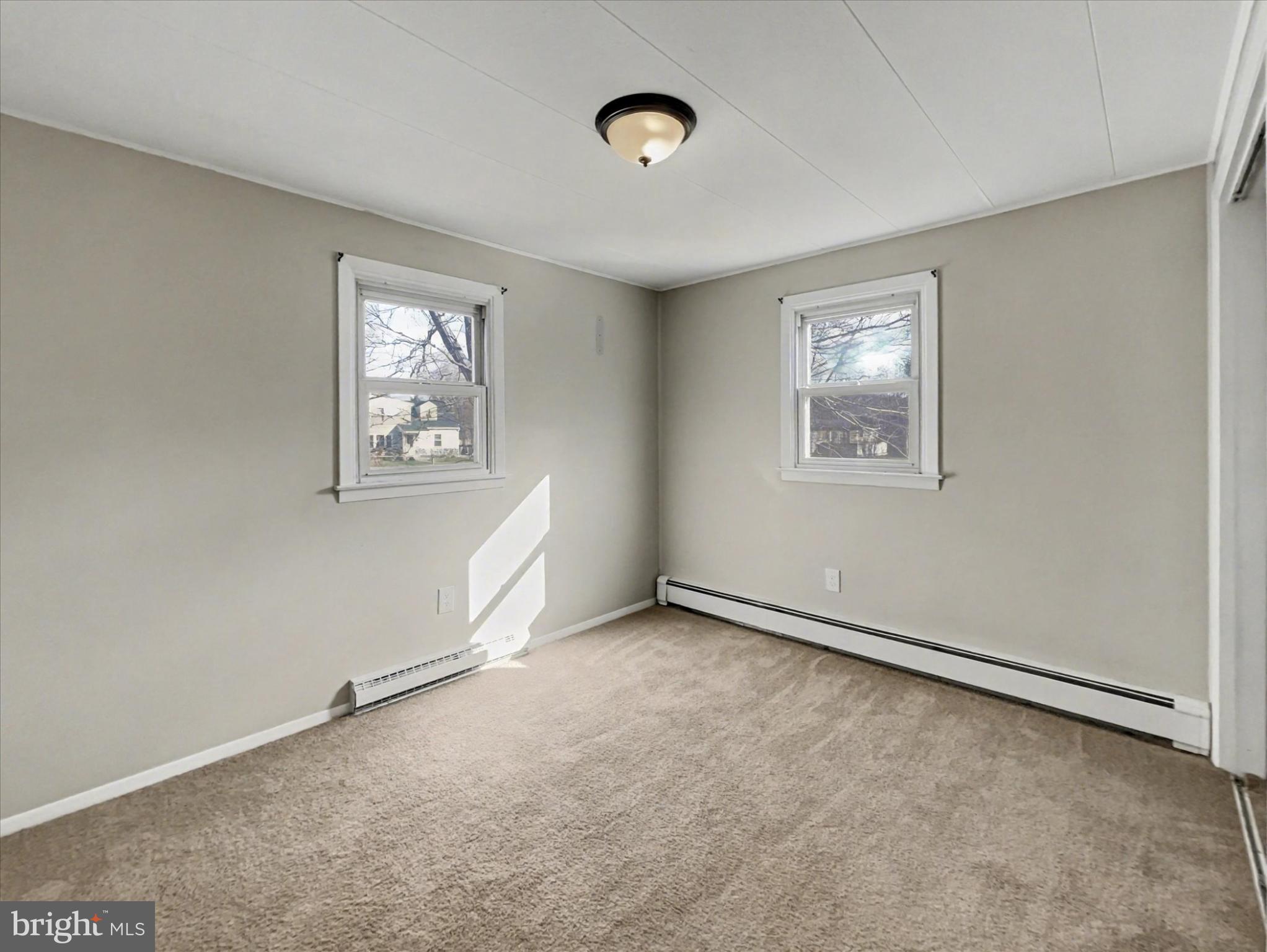 4968 Fairfield Road Fairfield, PA 17320 - Photo 15 of 32 an empty room with windows and closet