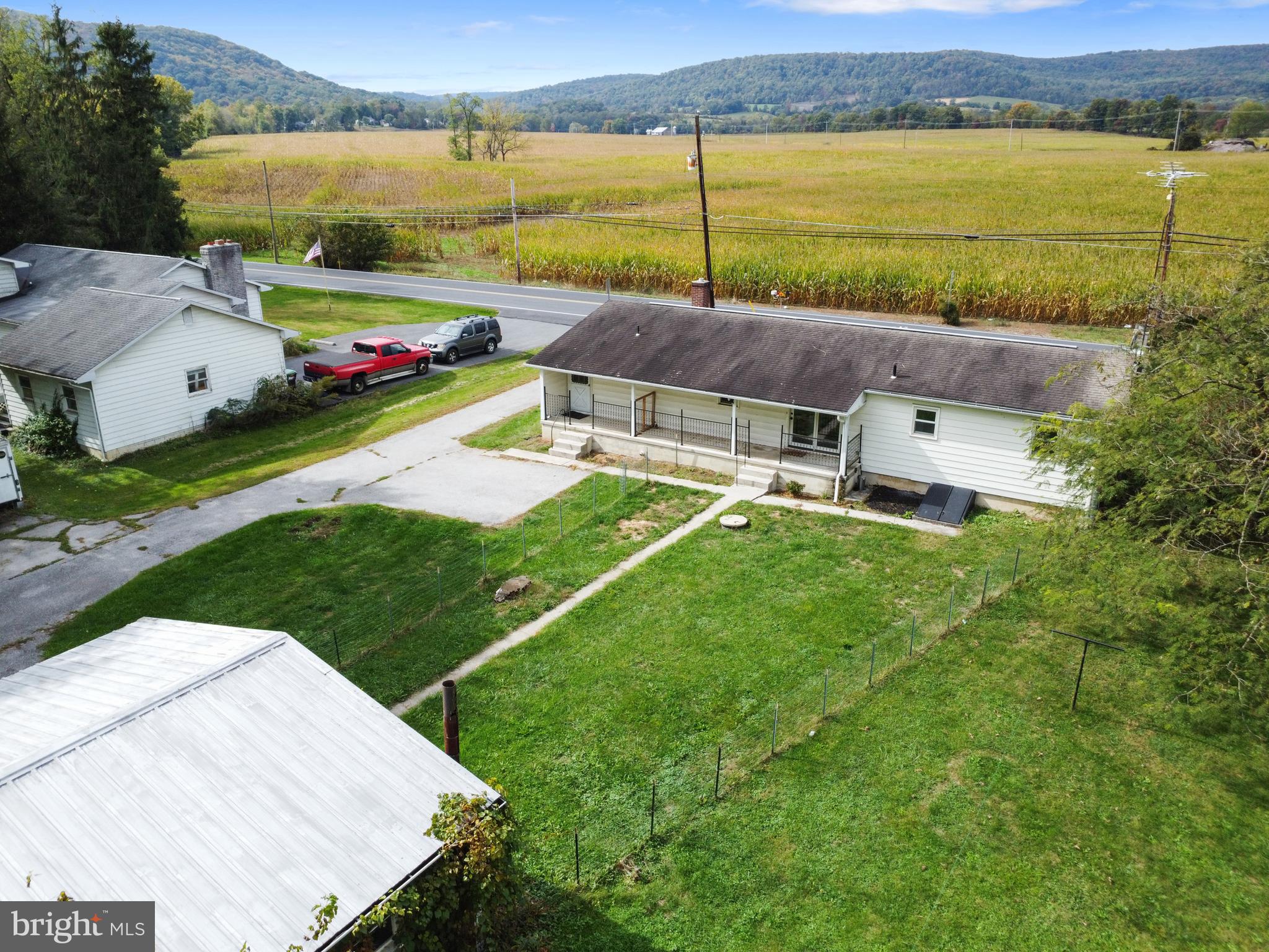 4968 Fairfield Road Fairfield, PA 17320 - Photo 2 of 32 an aerial view of a house with a garden and lake view