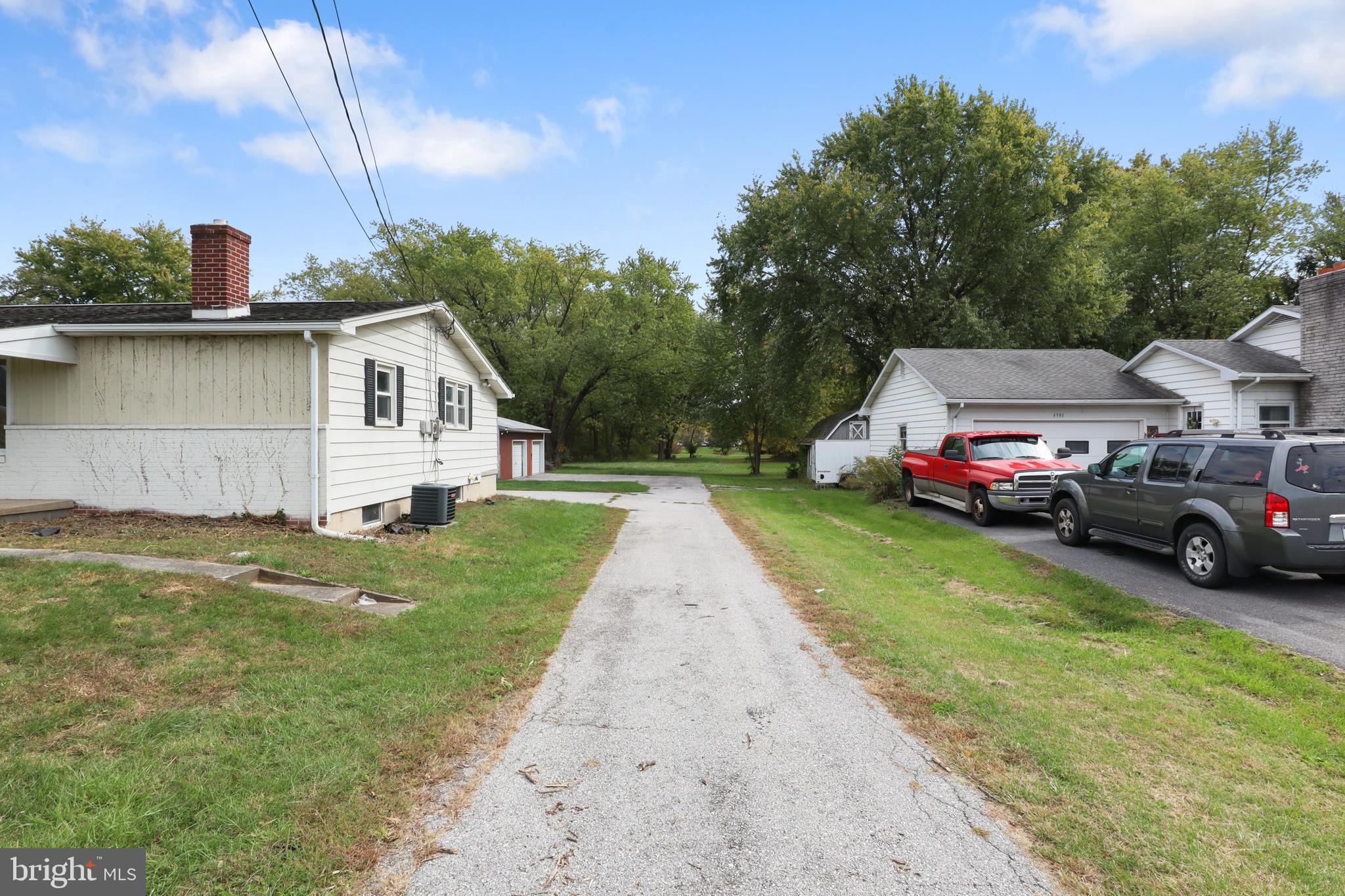 4968 Fairfield Road Fairfield, PA 17320 - Photo 22 of 32 a front view of a house with a garden and yard