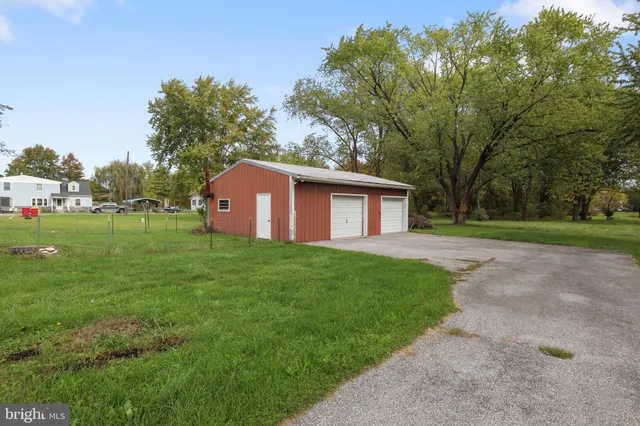 a house with a yard and parking space