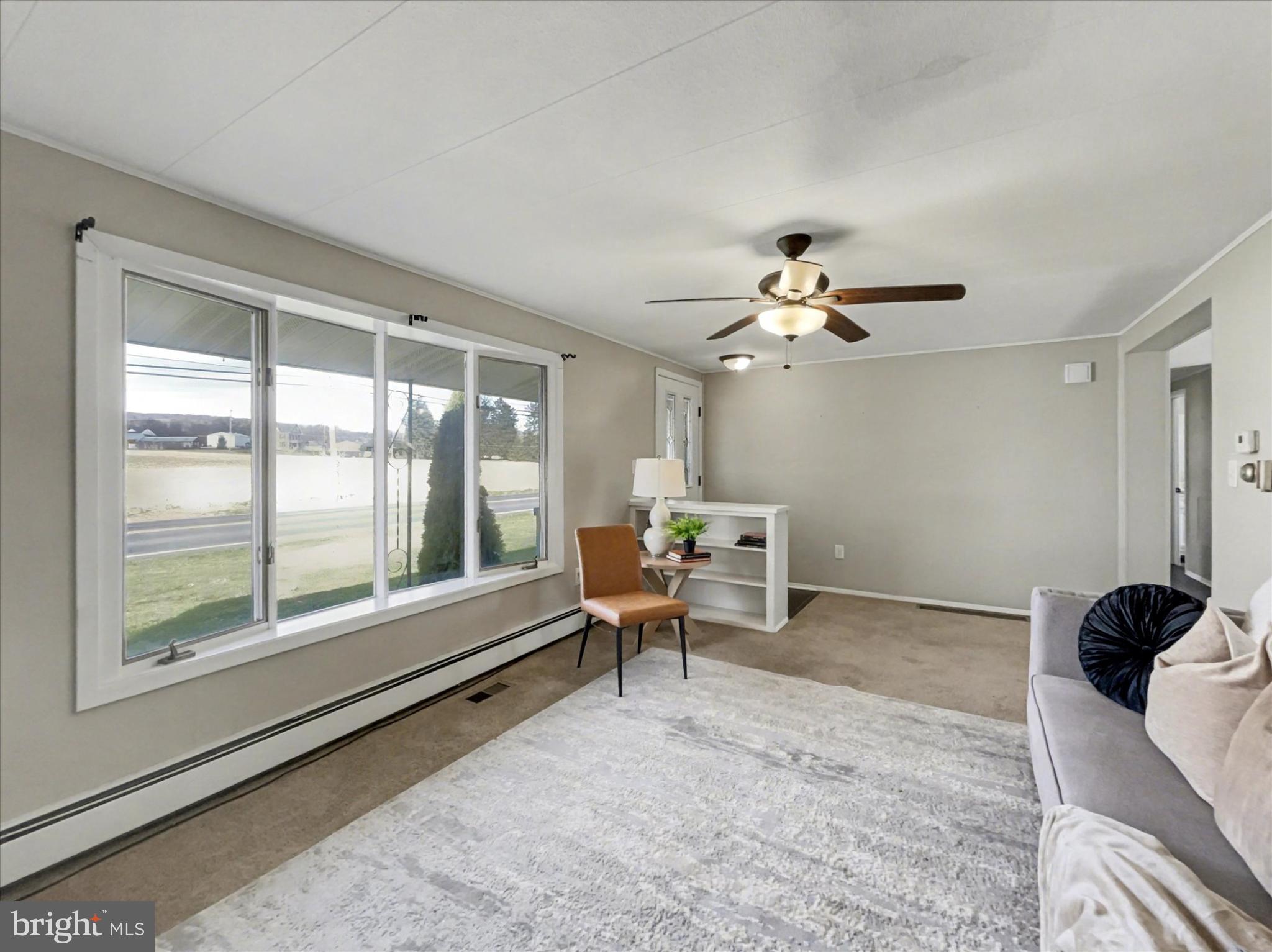 4968 Fairfield Road Fairfield, PA 17320 - Photo 4 of 32 a living room with furniture and a large window