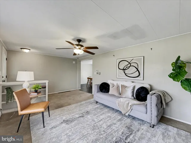a view of entryway with furniture and rug