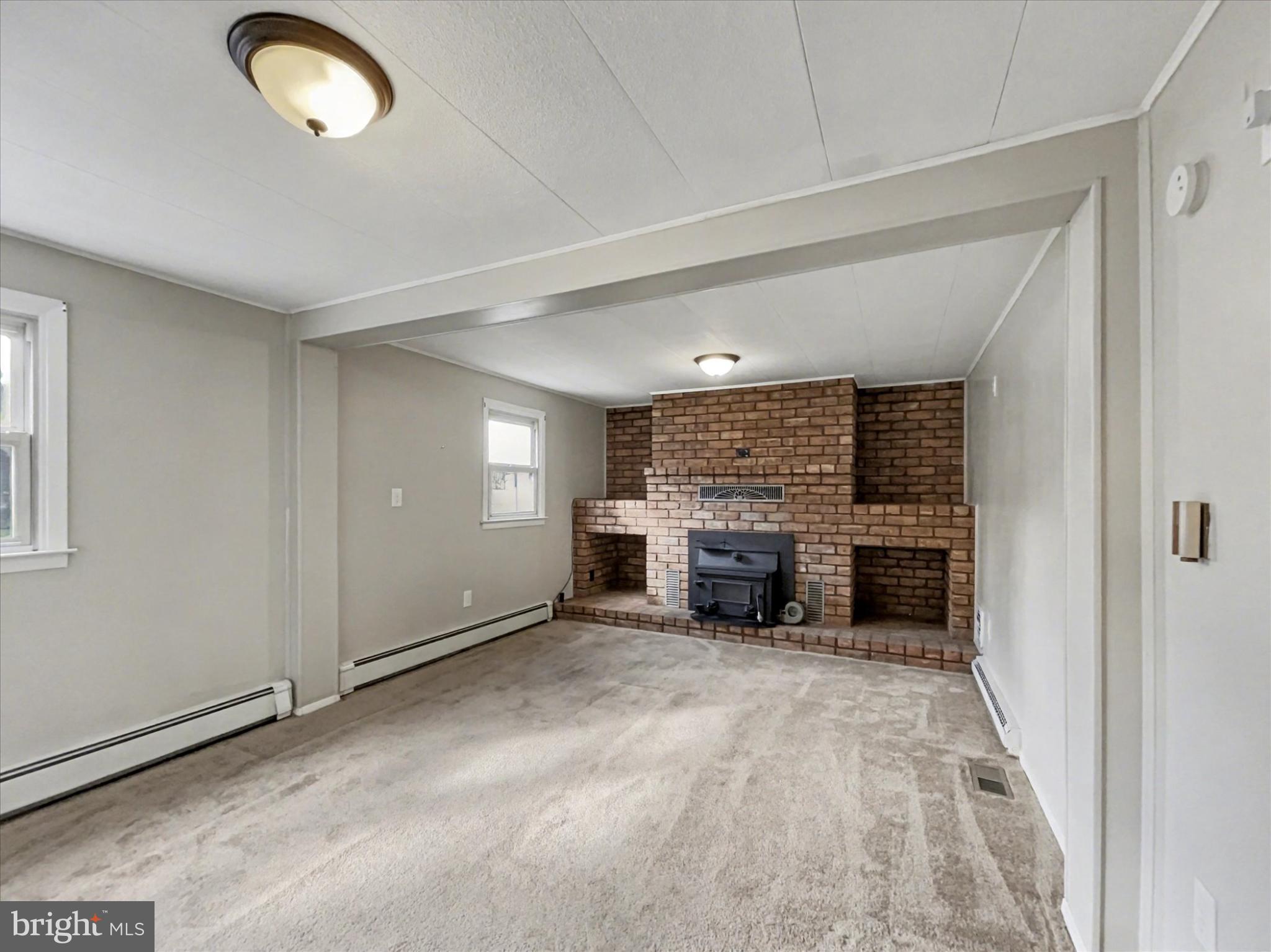 4968 Fairfield Road Fairfield, PA 17320 - Photo 8 of 32 a view of a livingroom with a furniture a fireplace and window