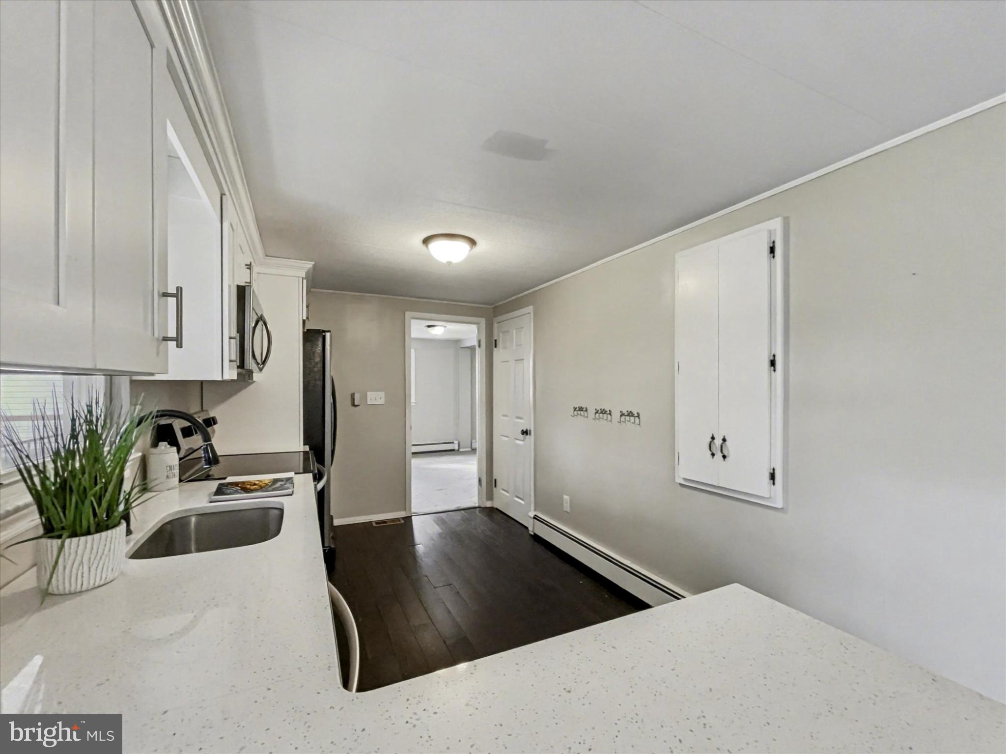 4968 Fairfield Road Fairfield, PA 17320 - Photo 10 of 32 a kitchen with granite countertop a sink a stove and cabinets