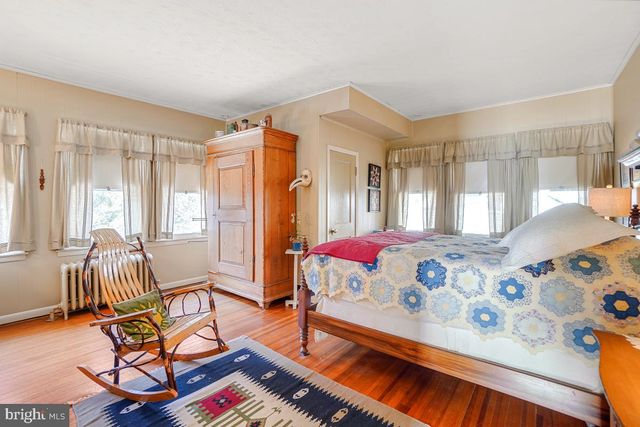 a bathroom with a shower toilet and a shower