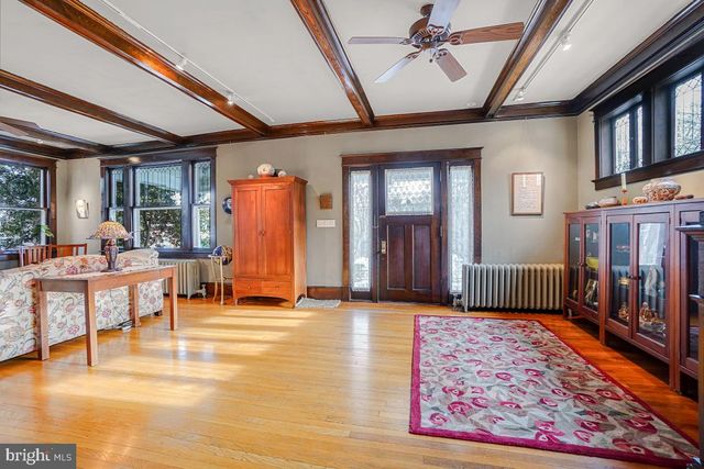 a living room with furniture fireplace and flat screen tv
