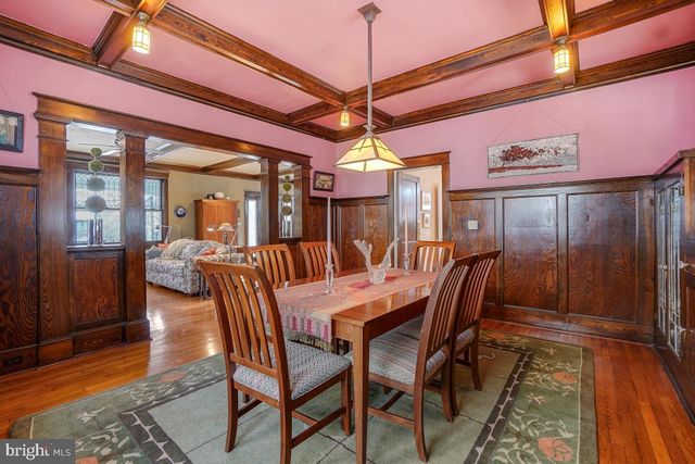 a kitchen with stainless steel appliances granite countertop a stove a sink dishwasher and cabinets with wooden floor