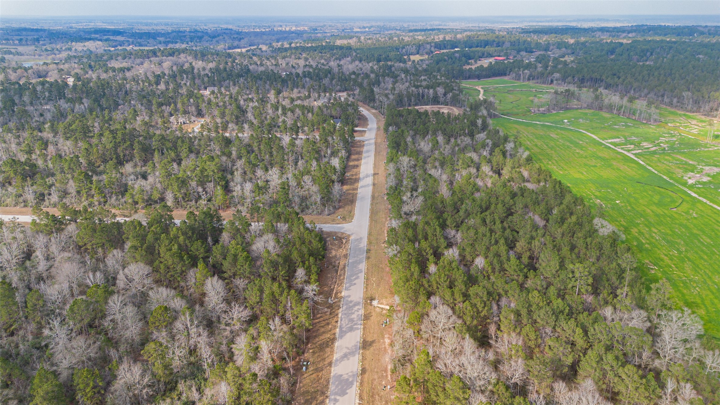 340 Exploration Road Willis, TX 77378 - Photo 7 of 12 an aerial view of residential houses with outdoor space and trees