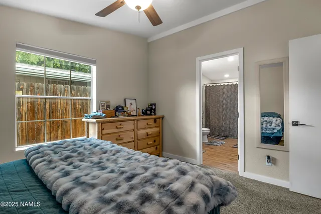 a bedroom with a bed and a dresser