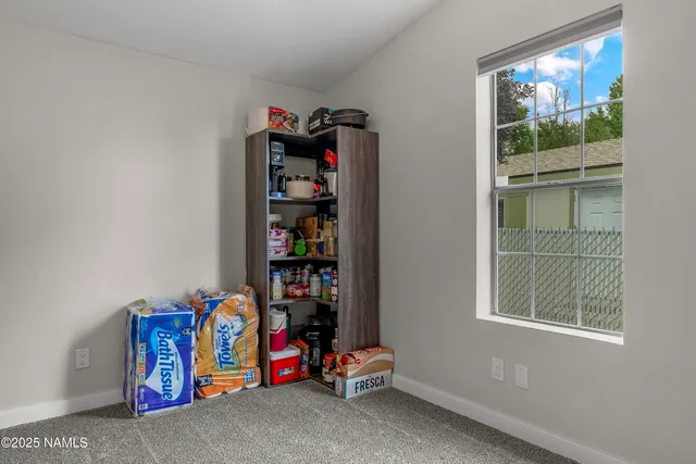 a bathroom with a toilet a sink and a large mirror