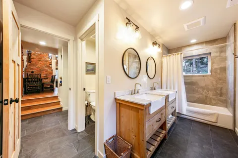 a view of a hallway with entryway wooden floor and front door