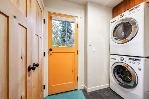a view of a hallway with washer and dryer