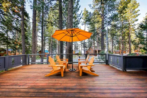 a view of swimming pool with lounge chairs