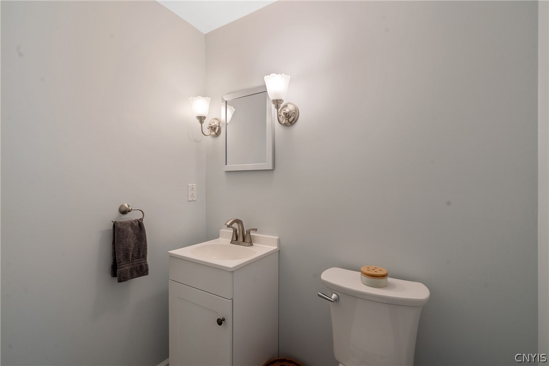 8069 Princess Path Clay, NY 13090 - Photo 15 of 50 Off the foyer is the updated half bath.