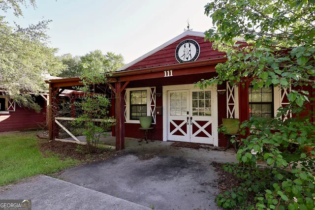 a area with lots of trees and flowers in the background