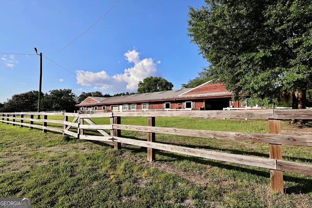 a view of swimming pool with a lake from nearby