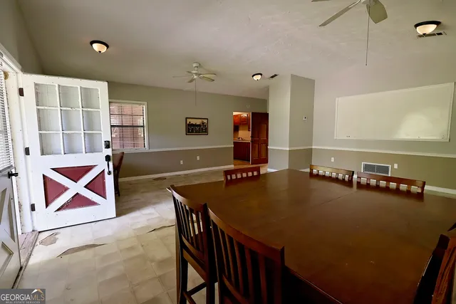 a view of a room with shelves and table