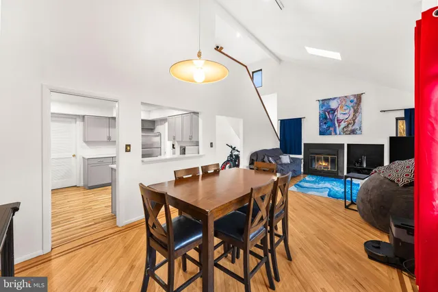 a view of a dining room with furniture and a fireplace
