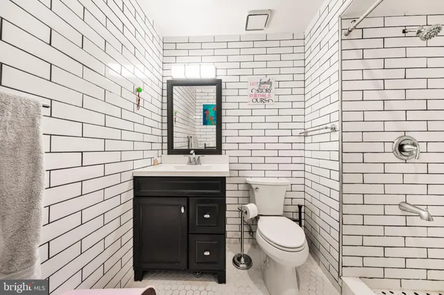 a bathroom with a toilet and shower