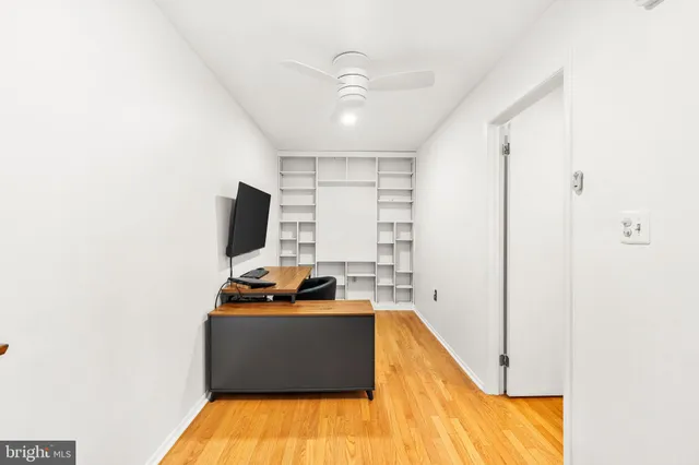 a bedroom with a bed and dresser