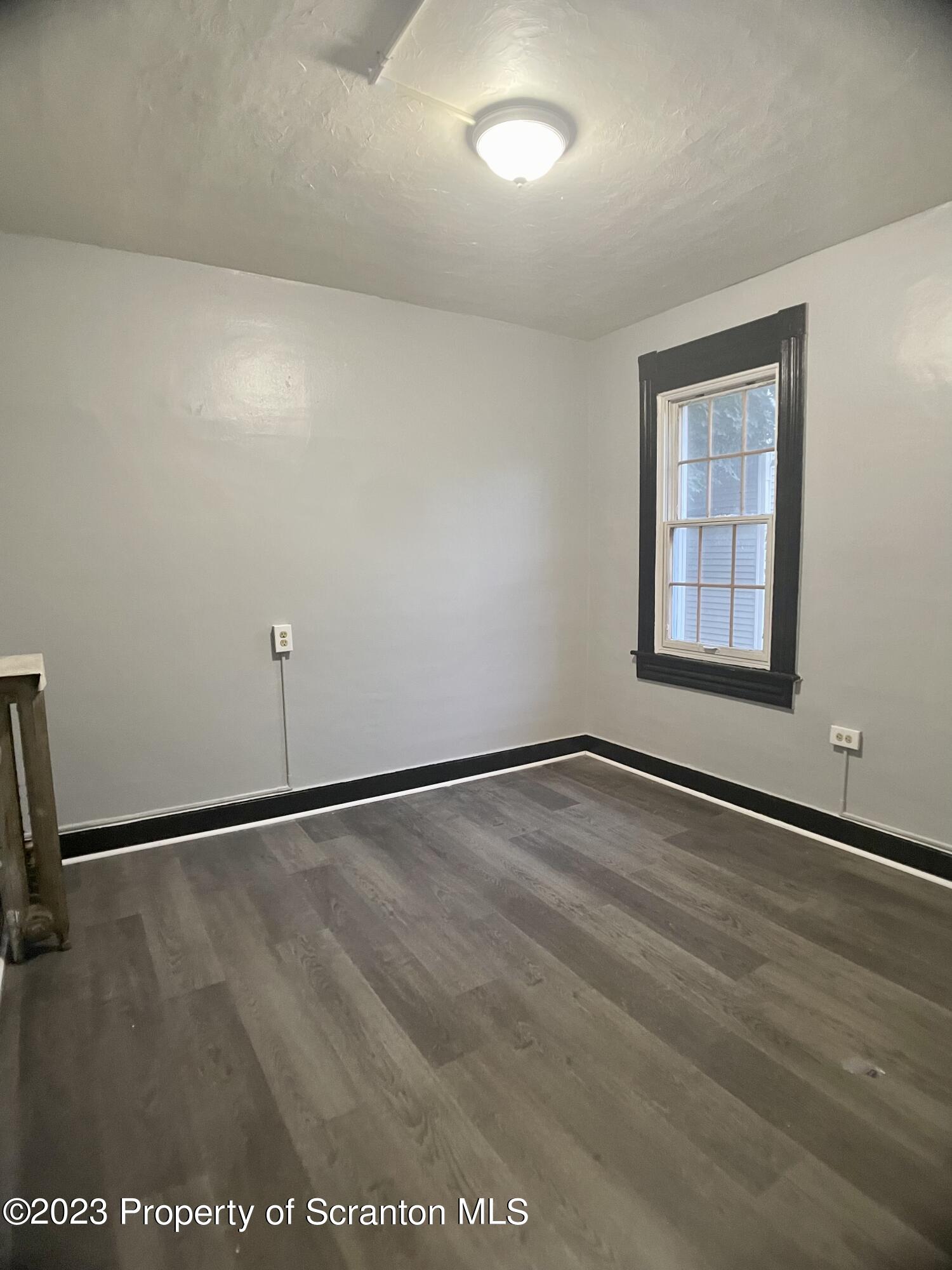 619 Green Ridge Street Scranton, PA 18509 - Photo 22 of 31 an empty room with a empty space and window