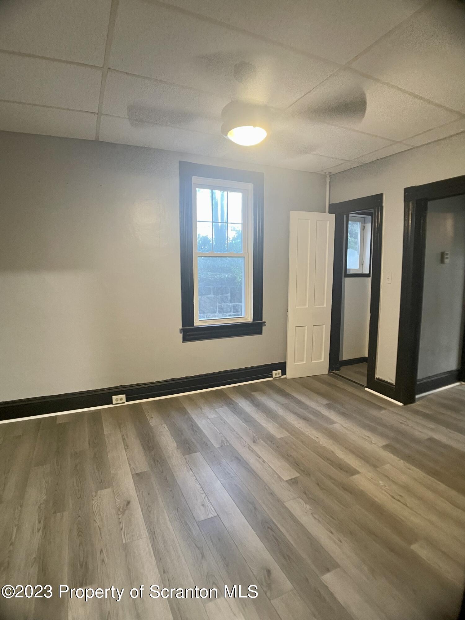 619 Green Ridge Street Scranton, PA 18509 - Photo 8 of 31 a view of an empty room and window