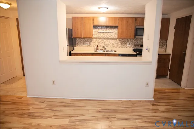 a view of kitchen with wooden floor