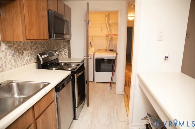a kitchen with a sink and a refrigerator