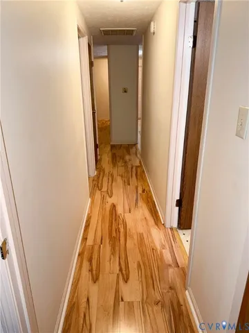 a view of bathroom with wooden floor