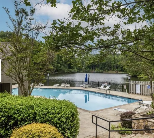 an aerial view of a houses with a yard