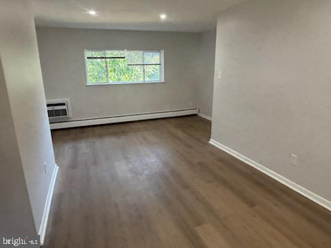 2032 Maple Avenue, Unit 8 Haddon Heights, NJ 08035 - Photo 5 of 12 an empty room with wooden floor and windows
