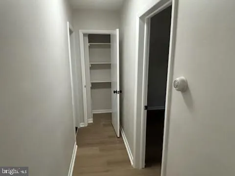 a view of a bathroom from a hallway