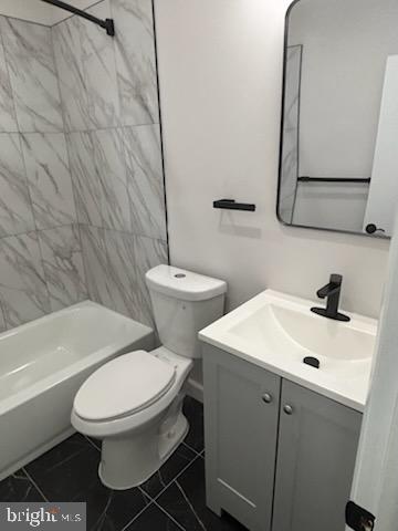 2032 Maple Avenue, Unit 8 Haddon Heights, NJ 08035 - Photo 10 of 12 a white toilet sitting next to a bathroom sink