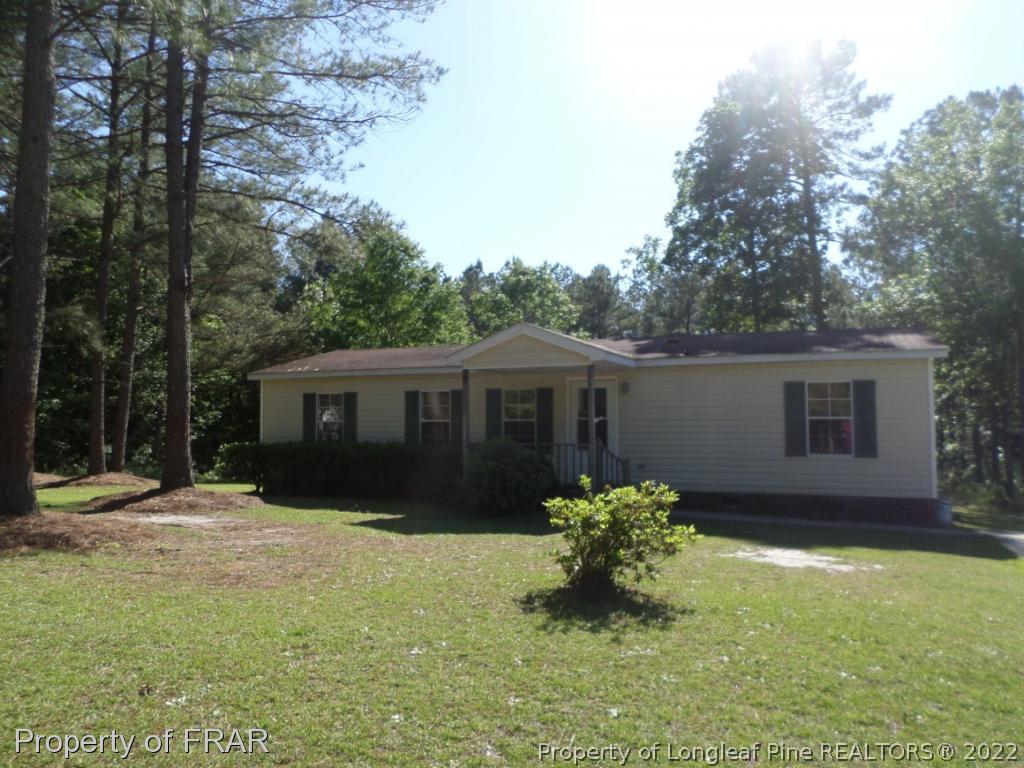 552 Lakerun Drive Bunnlevel, NC 28323 - Photo 1 of 31 a front view of a house with a yard