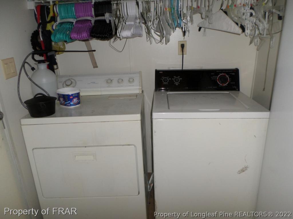 552 Lakerun Drive Bunnlevel, NC 28323 - Photo 23 of 31 a utility room with dryer and washer