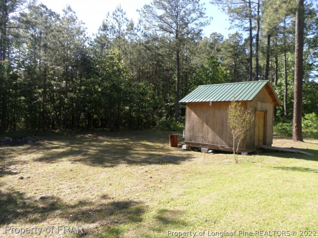 552 Lakerun Drive Bunnlevel, NC 28323 - Photo 28 of 31 a view of a house with a yard