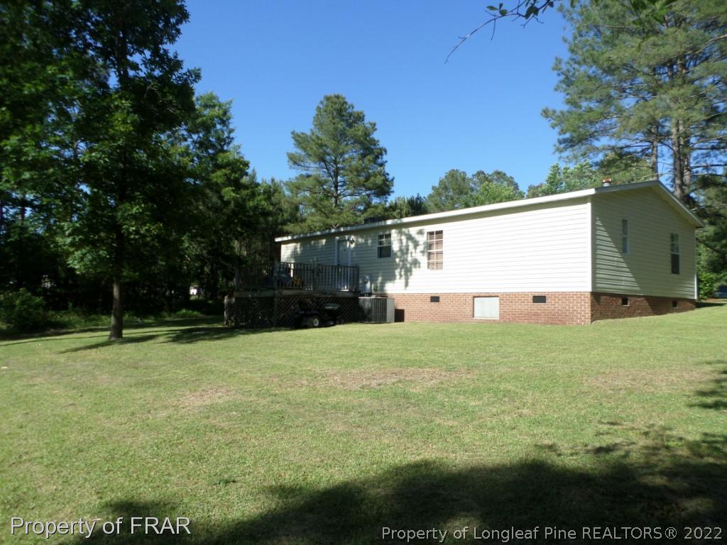 552 Lakerun Drive Bunnlevel, NC 28323 - Photo 30 of 31 a view of backyard with green space