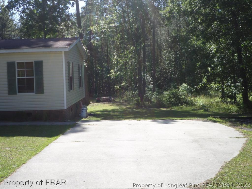552 Lakerun Drive Bunnlevel, NC 28323 - Photo 3 of 31 a view of backyard of house