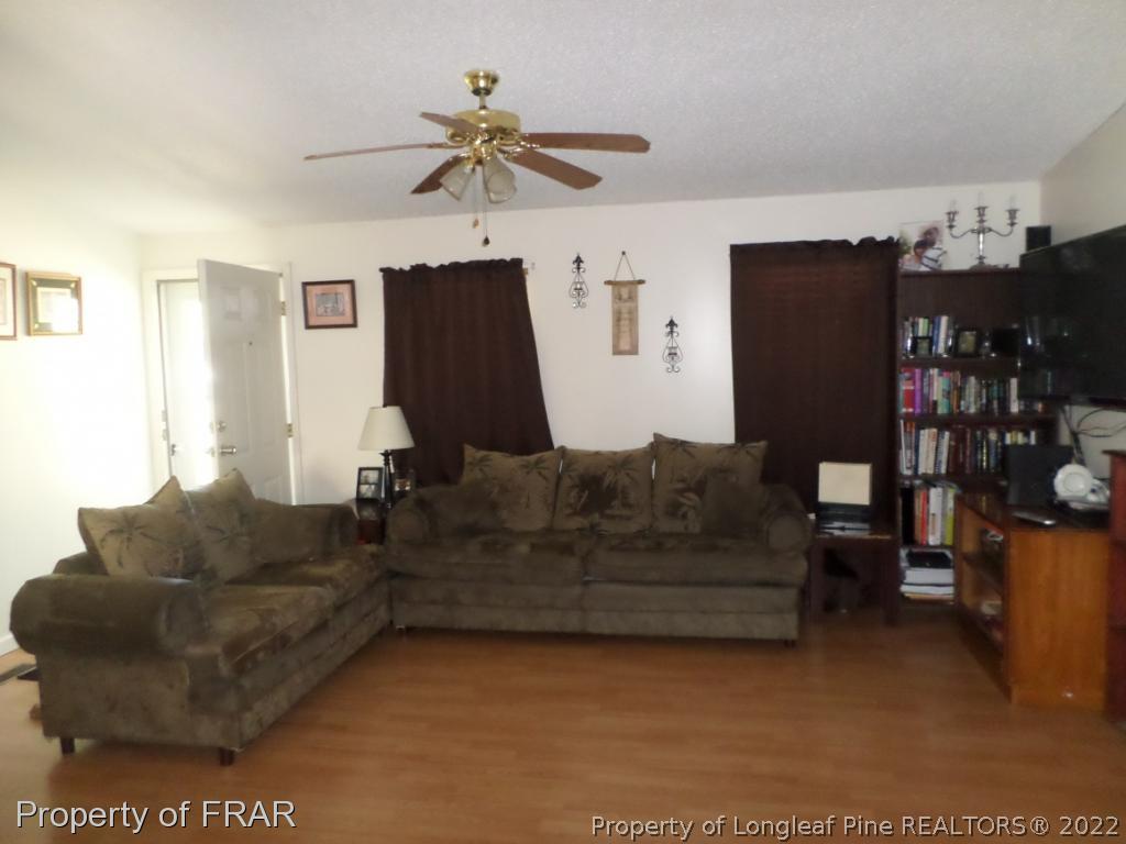 552 Lakerun Drive Bunnlevel, NC 28323 - Photo 5 of 31 a living room with furniture and a window