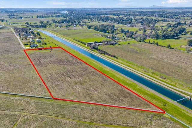 a view of a pool and an outdoor space