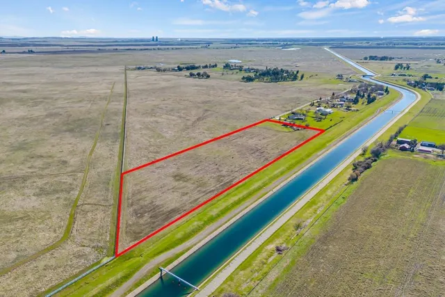 a view of a swimming pool and an outdoor seating