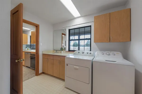 a utility room with dryer and washer