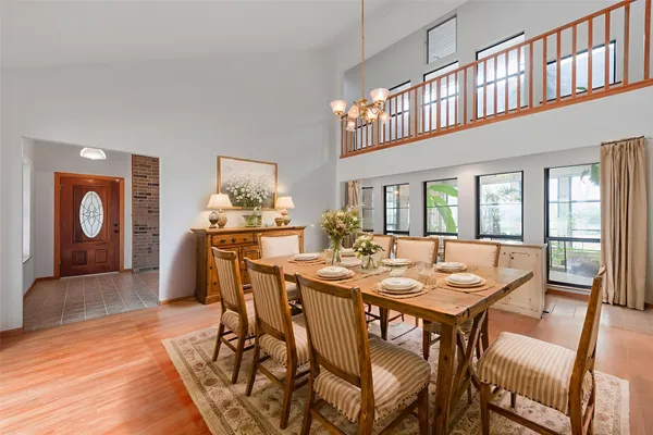 a view of a dining room with furniture window and wooden floor