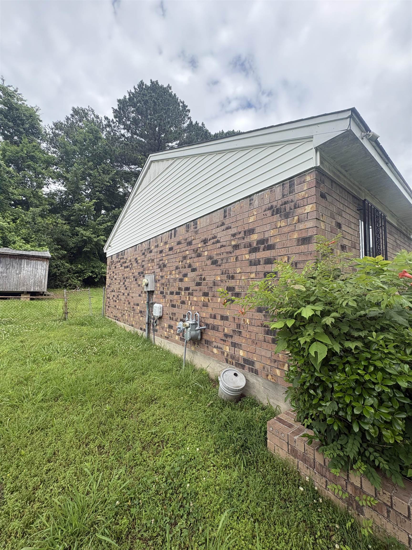 4585 Double Tree Street Memphis, TN 38109 - Photo 5 of 10 Brick exterior featuring light-colored siding on the gable end
