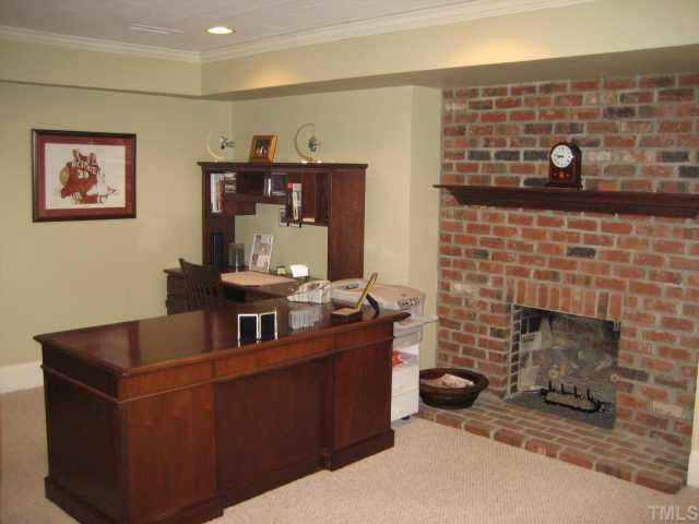 2614 Cooleemee Drive Raleigh, NC 27608 - Photo 11 of 12 a living room with furniture and a fireplace