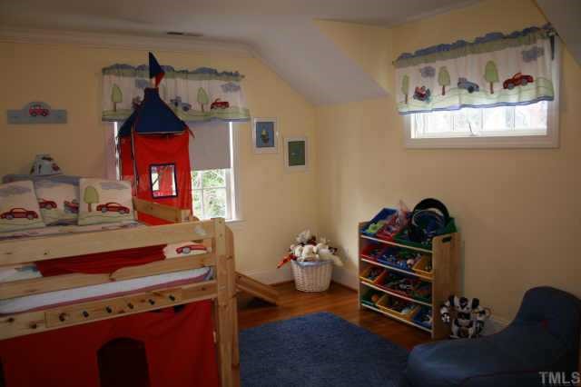 2614 Cooleemee Drive Raleigh, NC 27608 - Photo 3 of 12 a room with furniture and wooden floor