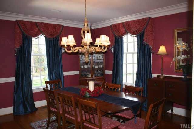 2614 Cooleemee Drive Raleigh, NC 27608 - Photo 8 of 12 a view of a dining room with furniture window and wooden floor