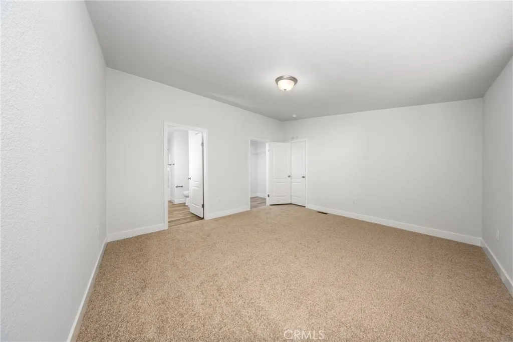 1855 East Riverside Drive, Unit 252 Ontario, CA 91761 - Photo 21 of 32 an empty room with a empty space and window