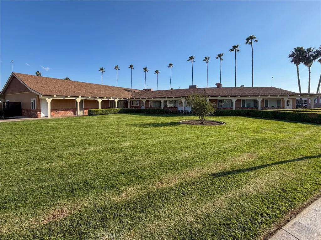 1855 East Riverside Drive, Unit 252 Ontario, CA 91761 - Photo 29 of 32 a view of a swimming pool with a yard